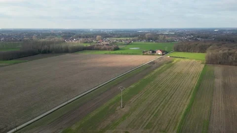 Fields Agriculture Rural Forwards drone aerial local roads farm house trees Stock Footage 233295910