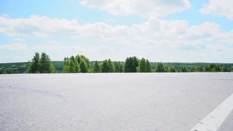Fields along the highway asphalt 動画素材 111857011