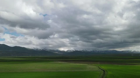 Fields and clouds time lapse Stock Footage 240764610