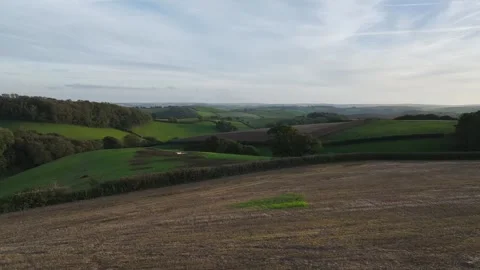 Fields and Farms at evening sun from a drone Torbay, Totnes, Devon, England Stock Footage 318623280