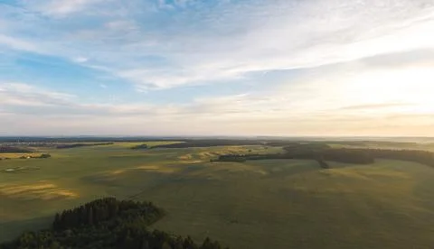 Fields and forests at sunset. Stock Photos