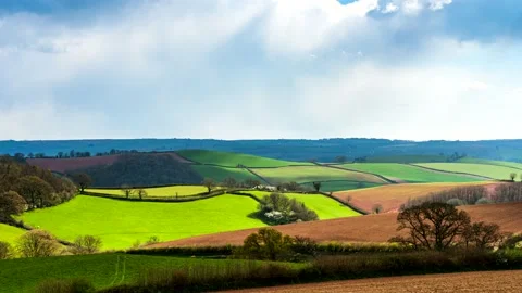 Fields and Meadows over English Village, Devon, England, Europe Stock Footage 152861659