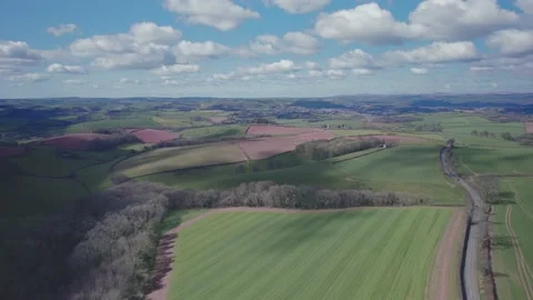 Fields and Meadows over English Village, Devon, England, Europe Stock Footage 173824499