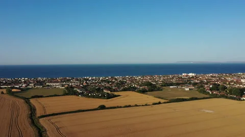 Fields and seaside town 動画素材 168417202