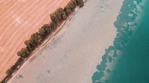 Fields flowing into the ocean. Stock Photos