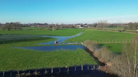 Fields Green Flooded Water drained forward drone aerial fences sunshine Stock Footage 231557458