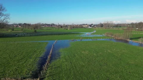 Fields Green Flooded Water drained forward drone aerial fences sunshine Stock Footage 231557459