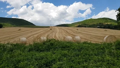 Fields with haystacks in Umbria, Italy Stock Footage 228407717