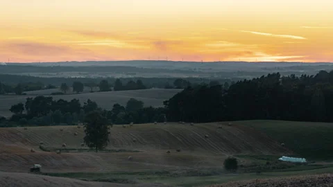 Fields on a hills during sunset with golden sunlight time lapse. Stock Footage 137445418