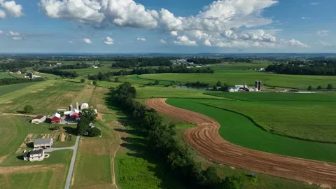 Fields make patterns in Lancaster County Pennsylvania farmland in summer. Stock Footage 205446007