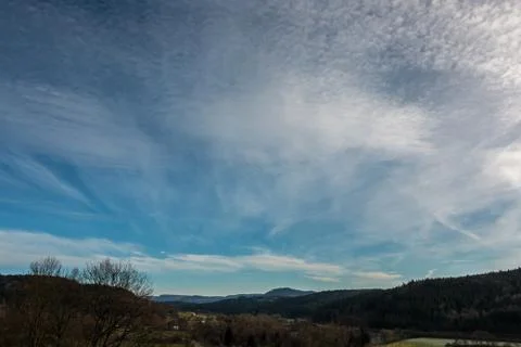 Fields, meadows, forests and white clouds in the blue sky Photos
