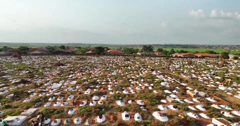 Fields of Memory New Tombs and Floral Tributes in Bissau Stock Footage 322723453