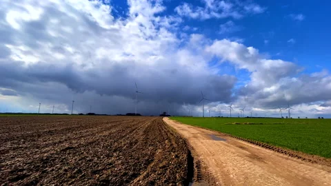 Fields under stormy clouds at springtime Stock Footage 237501213