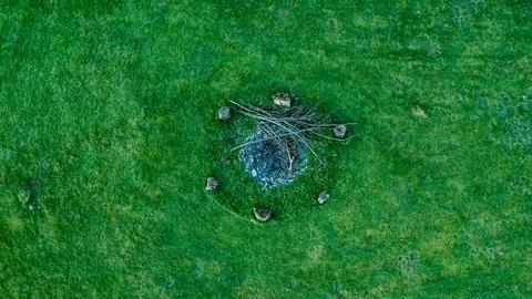 Fieldstone fire pit in the field Stock Photos