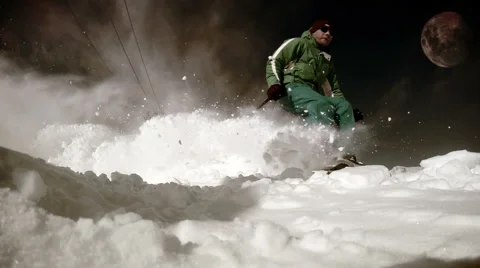 Fierce grunge footage of a skier casting a load of snow after him Video stock 59677136