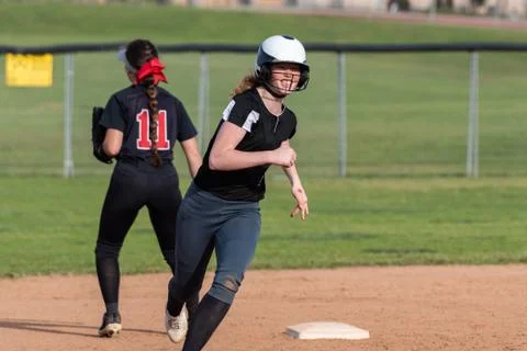 Fierce running around the base path. Stock Photos
