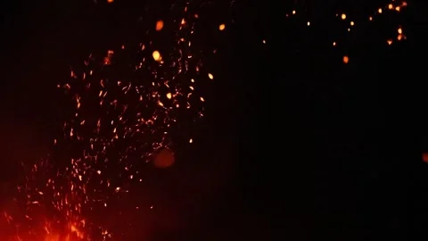 Fiery abstract background with glowing embers and swirling smoke rising dark Stock Footage 324072262