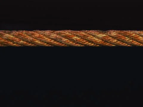 Fiery abstract rope texture on black background, stylized photo, Stock Photos