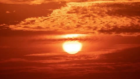 Fiery Blood-Red Sunset Sun Close-Up Through Glowing Cloud Layers at Dusk Stock Footage 341921975