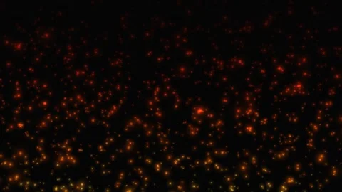 Fiery embers and glowing particles moving through dark space. 4K Stock Footage 345111723