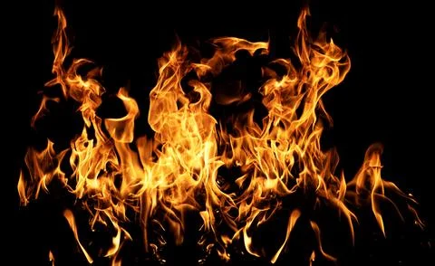 Fiery explosion background. Flames on black backdrop. Fire texture. Blazing fire Stock Photos