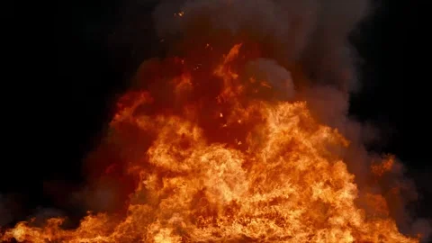 A fiery explosion on a black background. Realistic fire and smoke. Stock Footage 320101304