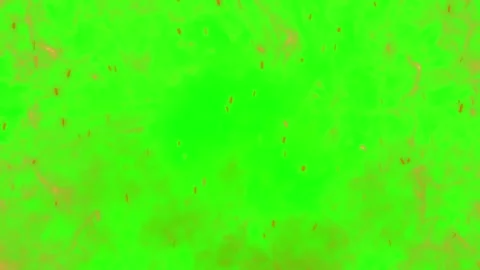 Fiery explosion debris trails across green screen background with dynamic Stock Footage 340946446
