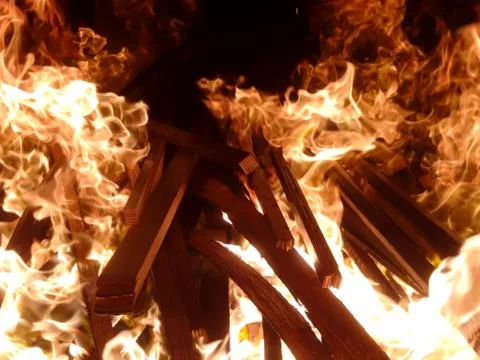 Fiery flame of fire on a black background close up Stock Photos