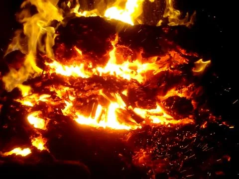 Fiery flame of fire on a black background close up Stock Photos