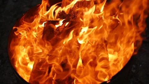 Fiery flames of a fire burning in a barbecue or brazier Stock Footage 152365364