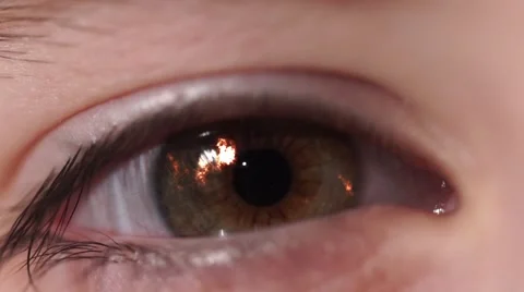 Fiery Flash in Children's Eye. An Eye Blinks and Changes Color to the Blue. Video stock 60583183