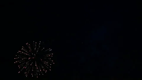 Fiery flashes of sparkle festive fireworks in the night sky. Stock Footage 121005474