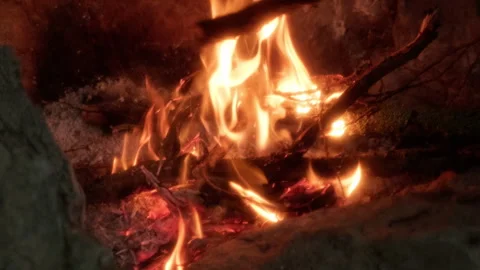 The Fiery Glow of Nature's Forge Illuminating a Serene Cave Filled with Ancient Stock Footage 257204831