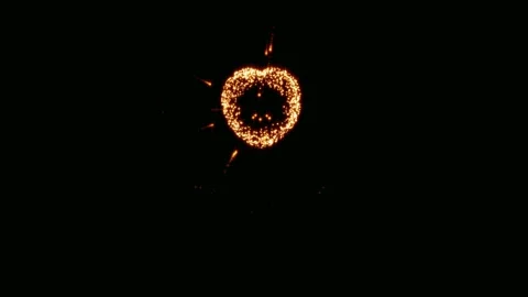 Fiery heart in the night sky. A mesmerizing display of fireworks forms a fiery  Video stock 302916752