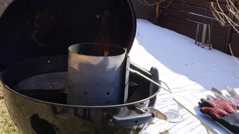 Fiery heat emanates from the grill as flames dance around ignition. Let the Video stock 273800486