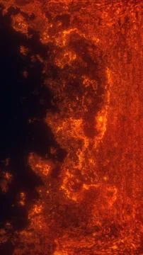 Fiery molten lava texture with glowing orange cracks and dark volcanic surf.. Stock Illustration