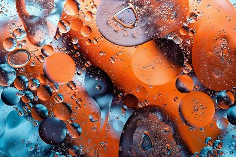Fiery orange and blue liquid ink abstract art 库存照片
