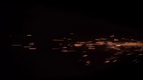 Fiery orange fireworks on a black background Stock Footage 129837707
