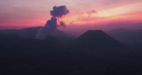 Fiery Orange Sky Above Mount Bromo – Volcanic Sunset Aerial Stock Footage 329260166