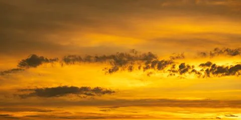 Fiery orange sky with clouds. Sky panorama at dusk Stock Photos