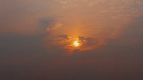 Fiery Orange Sun Behind Thin Clouds at Hazy Sunset, Wisconsin Stock Footage 341369383