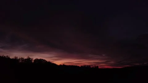 Fiery, peaceful sunset, sideward movement before Silhouette of trees, drone shot Stock-Footage 140220814