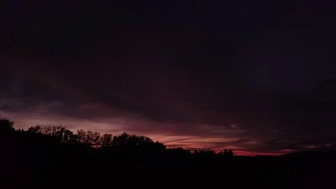 Fiery, peaceful sunset, sideward movement before Silhouette of trees, drone shot 스톡 동영상 140220876
