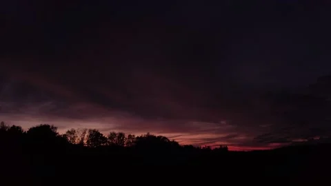 Fiery, peaceful sunset, sideward movement before Silhouette of trees, drone shot 스톡 동영상 140220877