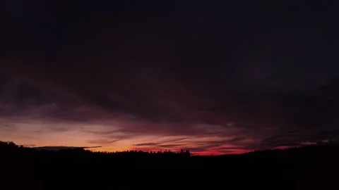 Fiery, peaceful sunset, sideward movement before Silhouette of trees, drone shot Stock-Footage 140220903
