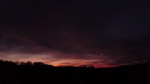 Fiery, peaceful sunset, sideward movement before Silhouette of trees, drone shot Stock-Footage 140220914