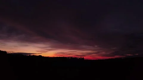 Fiery, peaceful sunset, sideward movement before Silhouette of trees, drone shot 스톡 동영상 140220976