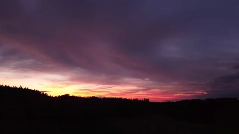 Fiery, peaceful sunset, sideward movement before Silhouette of trees, drone shot 스톡 동영상 140221206