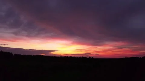 Fiery, peaceful sunset, sideward movement before Silhouette of trees, drone shot Stock-Footage 140221259