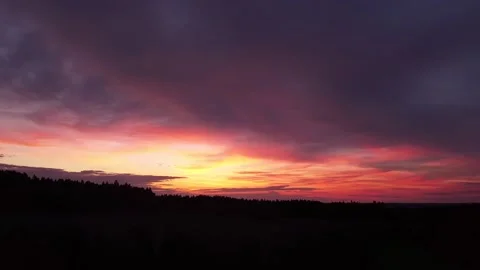 Fiery, peaceful sunset, sideward movement before Silhouette of trees, drone shot 스톡 동영상 140221280